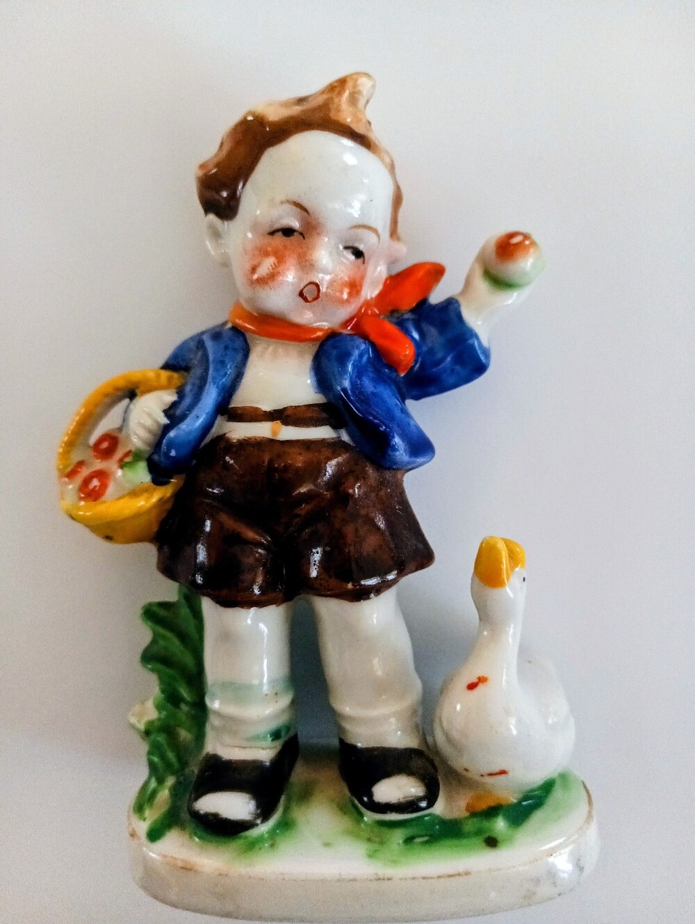 Hand-Painted Ceramic Boy Figurine in Blue Jacket and Brown Shorts